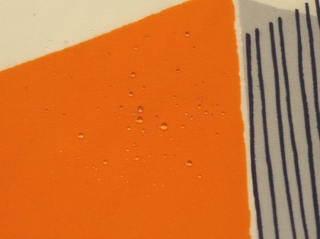  撥水 ナイロンタッサー　オレンジ系　大きな幾何学柄 【1.5m /2m/3mカット】